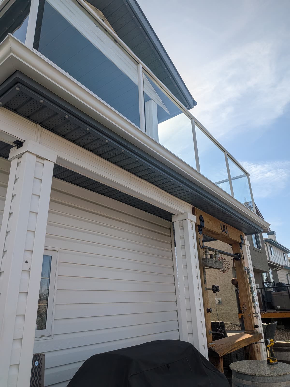 Gutter installation detail on home with elevated deck