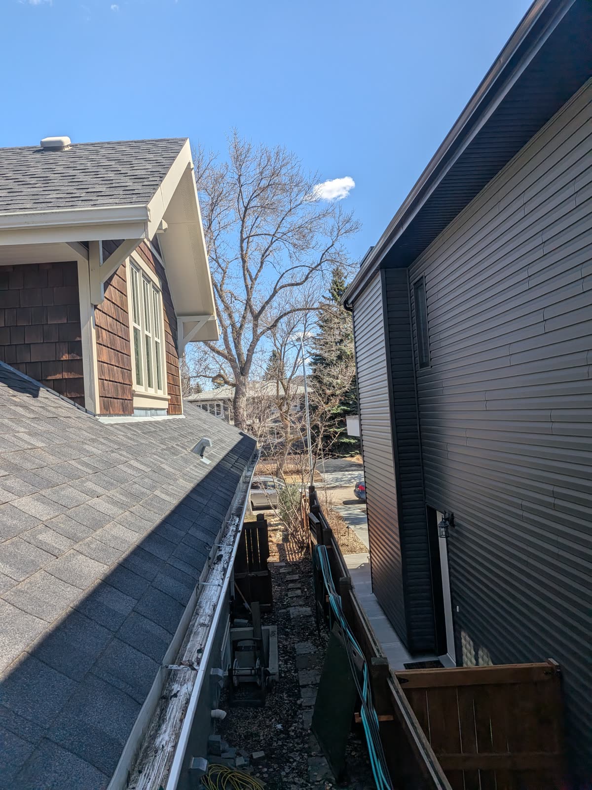 Gutter cleaning in progress on residential home