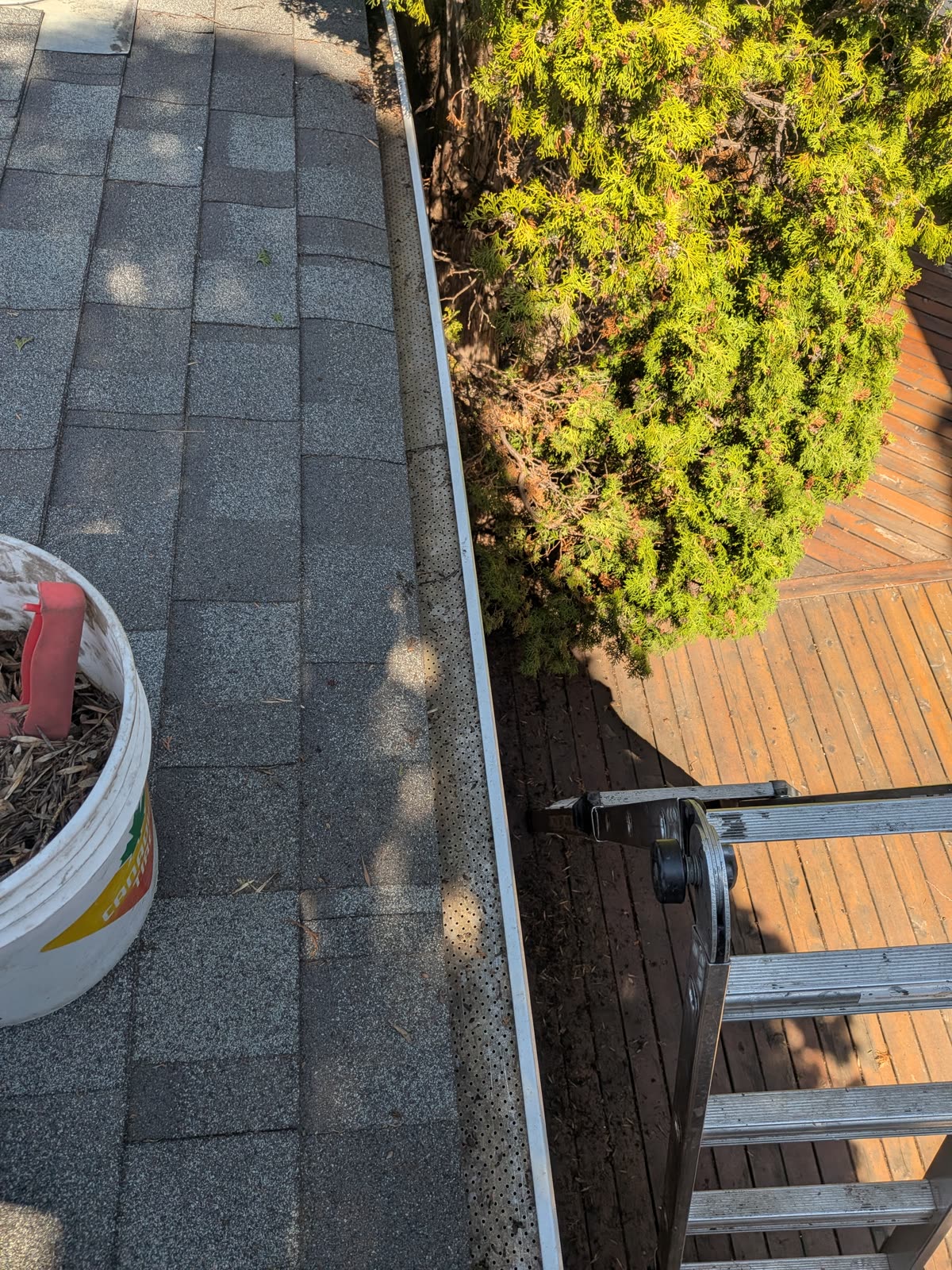 Eavestrough cleared of roof grit and debris
