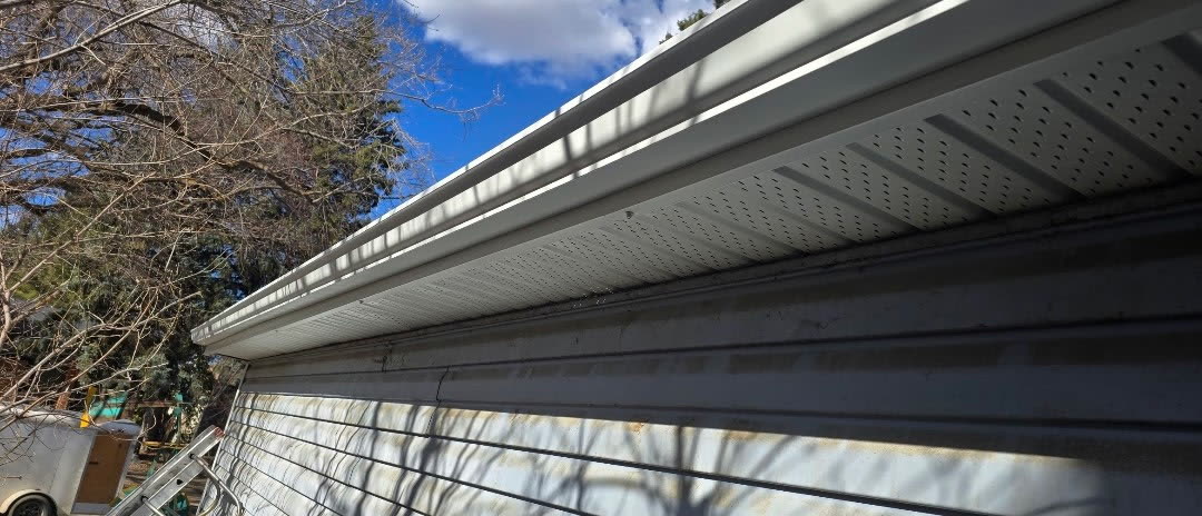 Finished gutter system with downspout on home