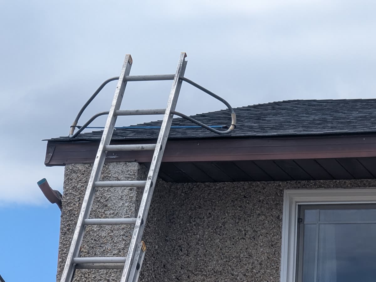 Gutter installation showing proper slope and fastening