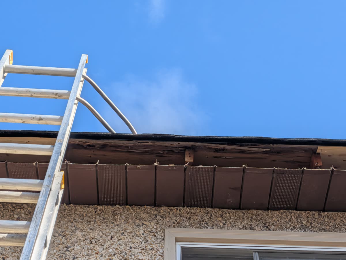 Residential gutter installation with outlet placement